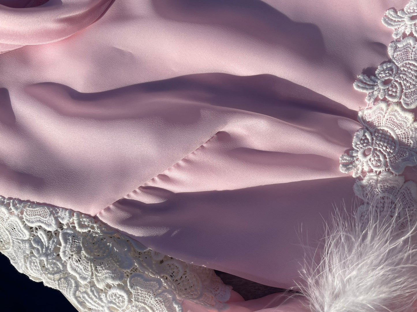 Pink feather trimmed gown with train