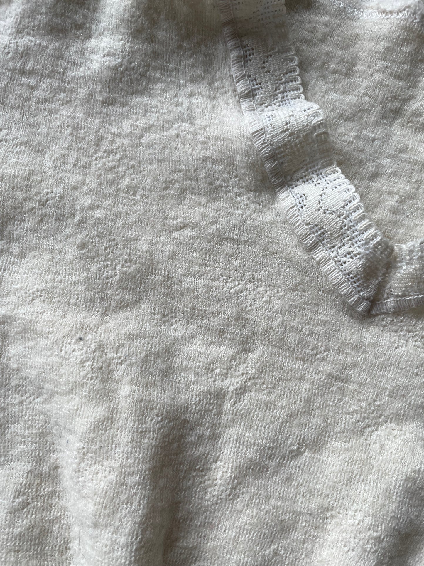 Eyelet lace ribbed peplum wool top
