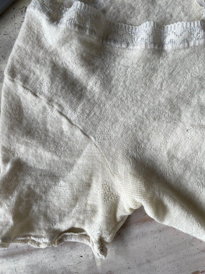 Eyelet lace ribbed peplum wool top