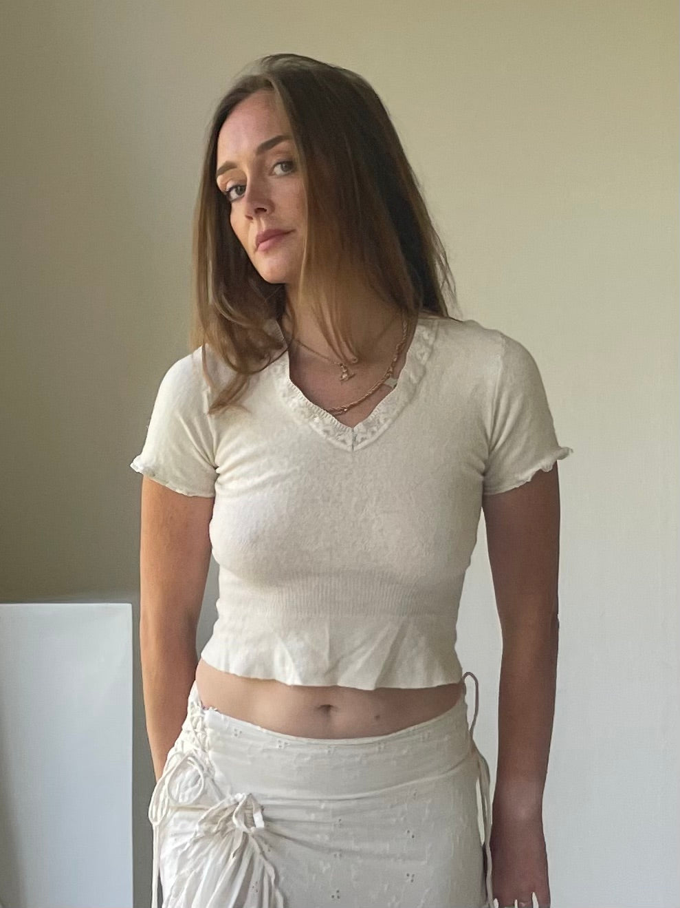 Eyelet lace ribbed peplum wool top