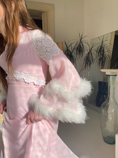 Pink feather trimmed gown with train