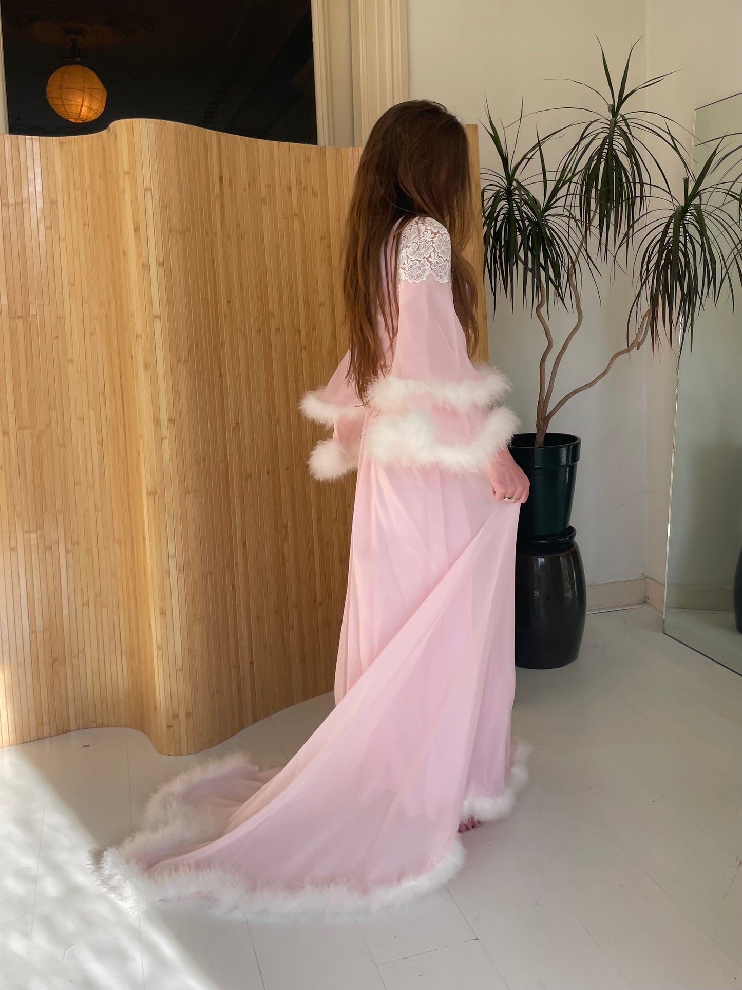 Pink feather trimmed gown with train