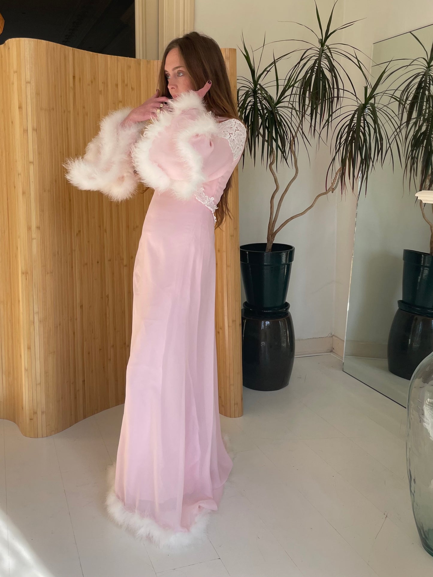Pink feather trimmed gown with train