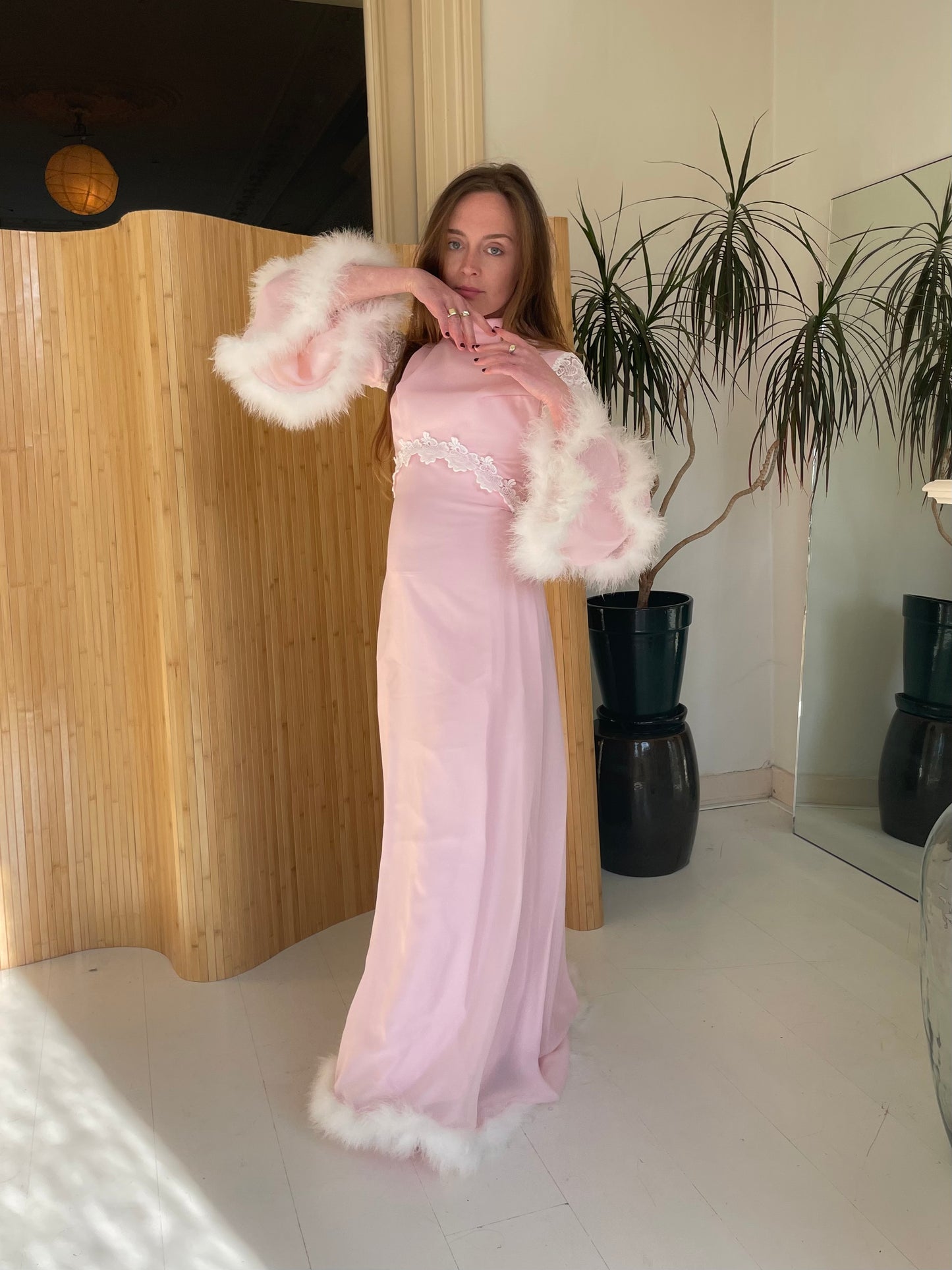 Pink feather trimmed gown with train