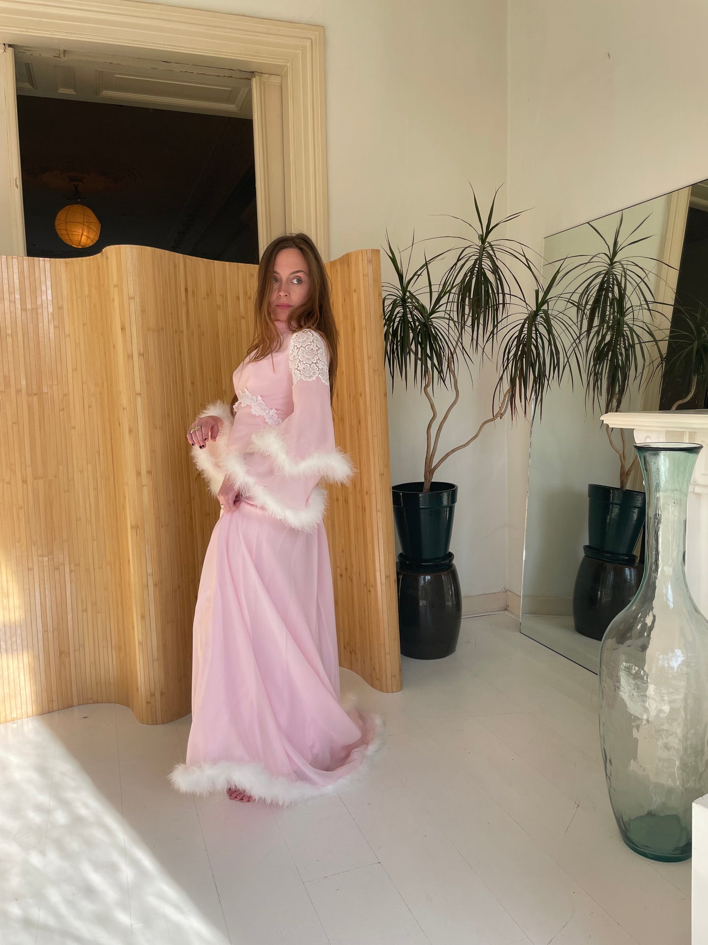 Pink feather trimmed gown with train