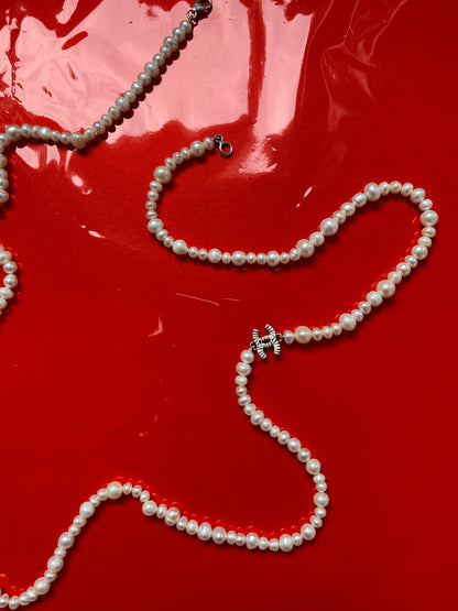 Vintage pearl necklace with chanel charm