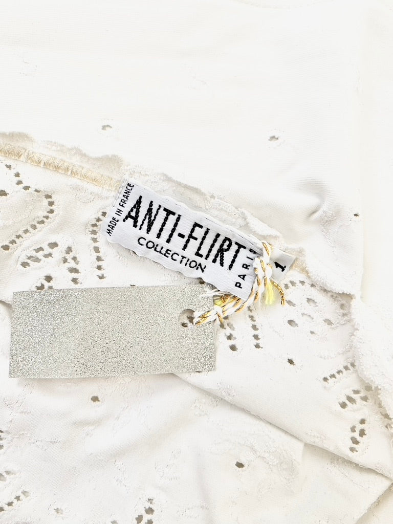 Anti-Flirt eye-let lace tube top