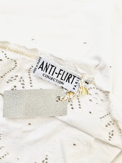 Anti-Flirt eye-let lace tube top